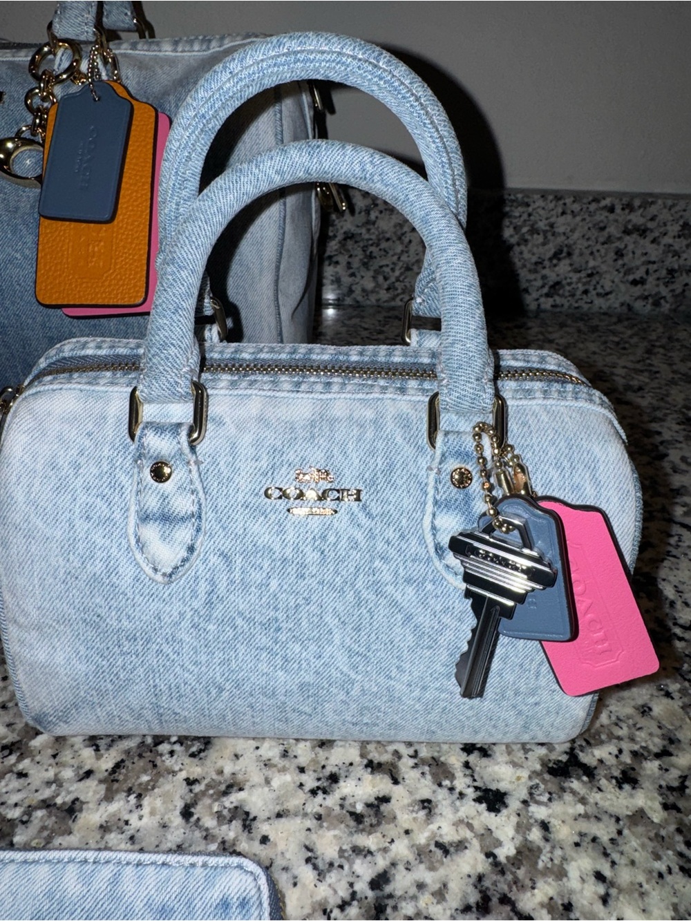 COACH loved denim mini Rowan with charms